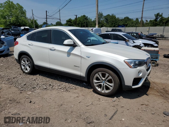 2015 BMW X4 xDrive28i with VIN 5UXXW3C56F0M87279, listed as a Copart auction lot 60426535 with 130,272 mi miles and Clean title. Bid and sale history available at DreamBid. Image 4.