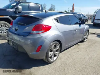 2016 Hyundai Veloster with VIN KMHTC6AD8GU296991, listed as a IAAI auction lot 41720599 with 108,121 mi miles. Bid and sale history available at carsss.com. Image 4.