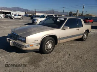 1988 Cadillac Eldorado with VIN 1G6EL1153JU612185, listed as a Copart auction lot 83786144 with 133,882 mi miles and Salvage Title. Bid and sale history available at DreamBid. Image 1.
