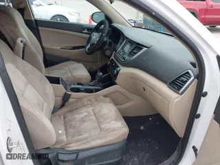 2016 Hyundai Tucson SE with VIN KM8J23A41GU232302, listed as a IAAI auction lot 42056851 with 119,159 mi miles. Bid and sale history available at carsss.com. Image 5.