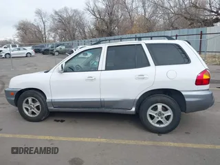 2004 Hyundai Santa Fe GLS with VIN KM8SC13DX4U609921, listed as a IAAI auction lot 41619492 with 113,592 mi miles. Bid and sale history available at carsss.com. Image 14.
