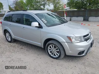 2014 Dodge Journey SXT with VIN 3C4PDCBG9ET209357, listed as a IAAI auction lot 42257467 with 121,786 mi miles and . Bid and sale history available at DreamBid. Image 1.