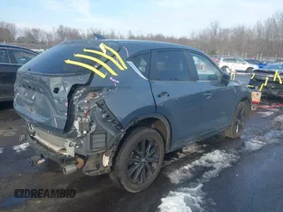 2021 Mazda CX-5 Touring z VIN JM3KFBCMXM0463469, wystawiony jako IAAI lot #41488993 z przebiegiem 28 582 mil mil oraz . Historia ofert i sprzedaży dostępna na DreamBid. Obrazek 4.