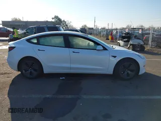2023 Tesla Model 3 with VIN 5YJ3E1EA2PF582331, listed as a IAAI auction lot 41043858 with 33,601 mi miles and . Bid and sale history available at DreamBid. Image 13.
