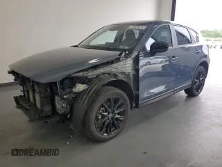 2024 Mazda CX-5 S Carbon Edition z VIN JM3KFBCL9R0499328, wystawiony jako Copart lot #60262085 z przebiegiem 24 662 mil mil oraz Czysty tytuł • Clean title. Historia ofert i sprzedaży dostępna na DreamBid. Obrazek 1.