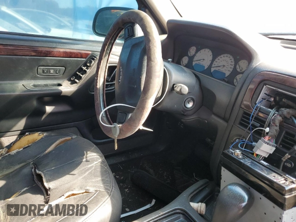 2004 Jeep Grand Cherokee with VIN 1J8GX58J54C284761, listed as a Copart auction lot 75614854 with 182,188 mi miles and Salvage title. Bid and sale history available at DreamBid. Image 7.