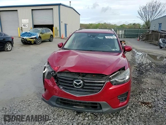 2016 Mazda CX-5 Grand Touring with VIN JM3KE4DY6G0753826, listed as a Copart auction lot 55391555 with 96,852 mi miles and Salvage Title. Bid and sale history available at DreamBid. Image 14.