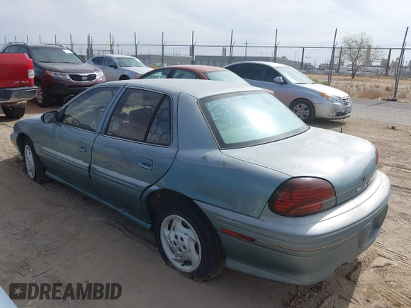 1996 Pontiac Grand Am SE with VIN 1G2NE52M8TC810732, listed as a IAAI auction lot 42338979 with 107,027 mi miles and . Bid and sale history available at DreamBid. Image 3.