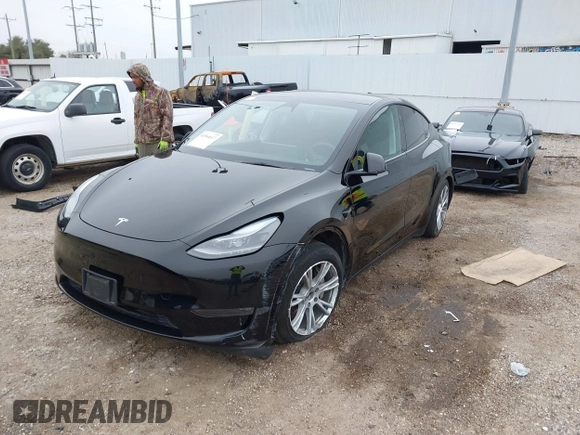 2023 Tesla Model Y Long Range z VIN 7SAYGDEEXPA181114, wystawiony jako IAAI lot #41564617 z przebiegiem 64 990 mil mil oraz . Historia ofert i sprzedaży dostępna na DreamBid. Obrazek 2.