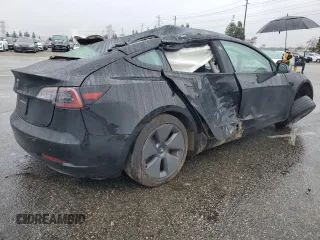 2023 Tesla Model 3 with VIN 5YJ3E1EA2PF671865, listed as a Copart auction lot 45220285 with 29,614 mi miles and Salvage title. Bid and sale history available at DreamBid. Image 3.