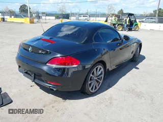 2011 BMW Z4 sDrive35i with VIN WBALM7C58BE383710, listed as a IAAI auction lot 41953452 with 102,510 mi miles. Bid and sale history available at carsss.com. Image 4.