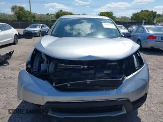2019 Honda CR-V LX with VIN 2HKRW5H31KH411771, listed as a IAAI auction lot 42060193 with 175,036 mi miles and . Bid and sale history available at DreamBid. Image 12.