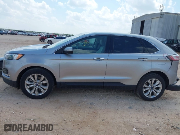 2022 Ford Edge Titanium with VIN 2FMPK4K99NBB06136, listed as a IAAI auction lot 42733977 with 57,794 mi miles and . Bid and sale history available at DreamBid. Image 14.
