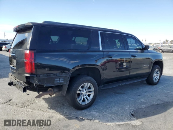 2017 Chevrolet Suburban LS with VIN 1GNSCGECXHR351539, listed as a Copart auction lot 87070214 with 246,129 mi miles and Salvage title. Bid and sale history available at DreamBid. Image 3.