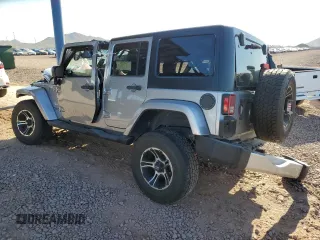 2015 Jeep Wrangler Unlimited Sahara z VIN 1C4BJWEG1FL617428, wystawiony jako Copart lot #55850005 z przebiegiem Nie podano mil oraz Szkoda całkowita • Salvage title. Historia ofert i sprzedaży dostępna na DreamBid. Obrazek 2.