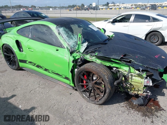 2019 Porsche 911 GT3 RS with VIN WP0AF2A94KS164340, listed as a IAAI auction lot 41319442 with 10,881 mi miles and . Bid and sale history available at DreamBid. Image 1.