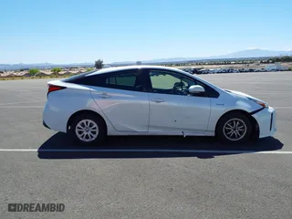 2021 Toyota Prius L Eco with VIN JTDKAMFU9M3133528, listed as a IAAI auction lot 41950856 with 138,787 mi miles. Bid and sale history available at carsss.com. Image 13.
