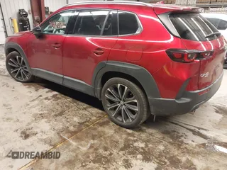 2023 Mazda CX-50 S Premium Plus with VIN 7MMVABEM8PN105411, listed as a IAAI auction lot 41378915 with 34,866 mi miles and . Bid and sale history available at DreamBid. Image 3.