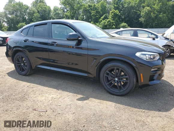 2021 BMW X4 xDrive30i with VIN 5UX2V1C09M9E03411, listed as a Copart auction lot 62078545 with 49,101 mi miles and Salvage title. Bid and sale history available at DreamBid. Image 4.