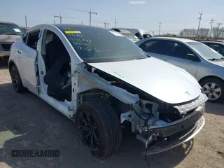 2024 Tesla Model Y with VIN 7SAYGDEDXRA300743, listed as a IAAI auction lot 41690374 with 12,446 mi miles and . Bid and sale history available at DreamBid. Image 1.