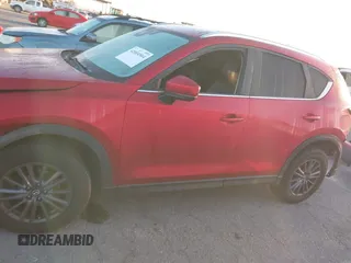 2020 Mazda CX-5 Touring z VIN JM3KFACM1L0855474, wystawiony jako IAAI lot #42004504 z przebiegiem 82 505 mil mil oraz . Historia ofert i sprzedaży dostępna na DreamBid. Obrazek 14.