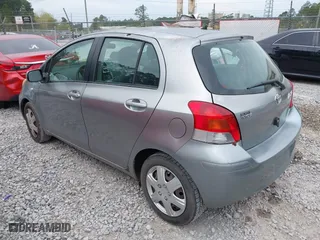 2010 Toyota Yaris with VIN JTDKT4K38A5296999, listed as a IAAI auction lot 41878127 with 122,692 mi miles. Bid and sale history available at carsss.com. Image 3.