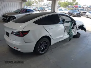 2023 Tesla Model 3 z VIN 5YJ3E1EAXPF606178, wystawiony jako IAAI lot #42543528 z przebiegiem 26 638 mil mil oraz . Historia ofert i sprzedaży dostępna na DreamBid. Obrazek 4.
