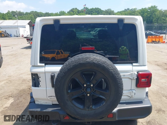 2021 Jeep Wrangler Unlimited Sahara with VIN 1C4HJXEN1MW618508, listed as a IAAI auction lot 42639515 with 39,747 mi miles and . Bid and sale history available at DreamBid. Image 16.