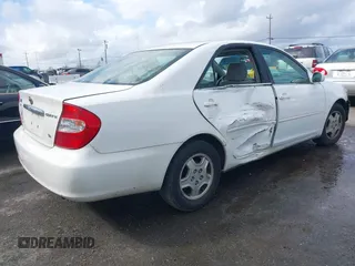 2002 Toyota Camry XLE z VIN 4T1BF30KX2U035422, wystawiony jako IAAI lot #41762363 z przebiegiem 220 465 mil mil oraz . Historia ofert i sprzedaży dostępna na DreamBid. Obrazek 4.