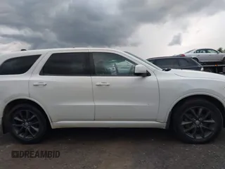 2014 Dodge Durango SXT with VIN 1C4RDJAG0EC561950, listed as a IAAI auction lot 42650331 with 106,959 mi miles and . Bid and sale history available at DreamBid. Image 14.