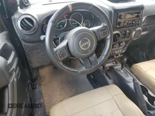 2012 Jeep Wrangler Unlimited Sport z VIN 1C4BJWDG7CL208265, wystawiony jako Copart lot #56101095 z przebiegiem 141 527 mil mil oraz Szkoda całkowita • Salvage title. Historia ofert i sprzedaży dostępna na DreamBid. Obrazek 8.