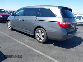2013 Honda Odyssey Touring with VIN 5FNRL5H95DB045666, listed as a IAAI auction lot 42117219 with 50,715 mi miles and . Bid and sale history available at carsss.com. Image 3.