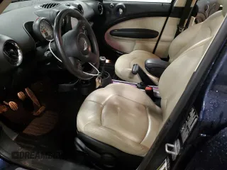 2013 MINI Countryman S ALL4 with VIN WMWZC5C5XDWM16477, listed as a Copart auction lot 51666385 with 112,383 mi miles and Salvage title. Bid and sale history available at DreamBid. Image 7.