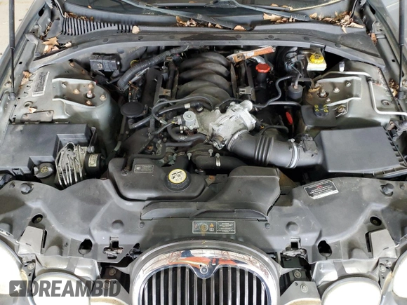 2003 Jaguar S-Type z VIN SAJEA01U93HM88490, wystawiony jako Copart lot #55721795 z przebiegiem 192 773 mil mil oraz Tytuł czysty. Historia ofert i sprzedaży dostępna na DreamBid. Obrazek 11.