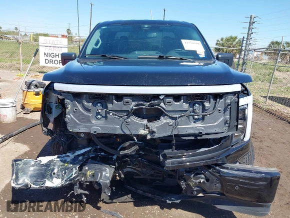 2023 Ford F-150 Lightning Pro with VIN 1FTVW1EV0PWG52297, listed as a IAAI auction lot 41730201 with 11,303 mi miles. Bid and sale history available at carsss.com. Image 12.