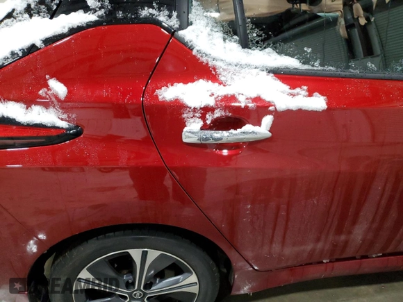 2021 Nissan LEAF SV Plus z VIN 1N4BZ1CV6MC554732, wystawiony jako Copart lot #86534494 z przebiegiem Nie podano mil oraz Szkoda całkowita • Salvage title. Historia ofert i sprzedaży dostępna na DreamBid. Obrazek 11.