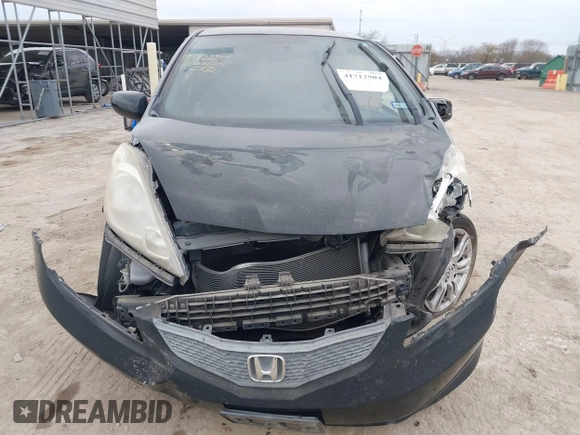 2009 Honda Fit Sport with VIN JHMGE88499S027610, listed as a IAAI auction lot 41712904 with 147,069 mi miles. Bid and sale history available at carsss.com. Image 12.