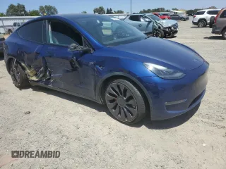 2022 Tesla Model Y Performance z VIN 7SAYGDEF6NF337710, wystawiony jako Copart lot #60200985 z przebiegiem 101 168 mil mil oraz Szkoda całkowita • Salvage title. Historia ofert i sprzedaży dostępna na DreamBid. Obrazek 4.