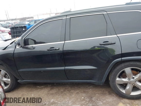 2013 Jeep Grand Cherokee Overland with VIN 1C4RJFCG1DC593890, listed as a IAAI auction lot 41264434 with 204,324 mi miles. Bid and sale history available at carsss.com. Image 13.