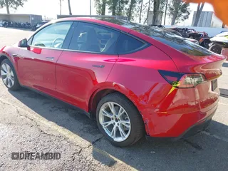 2020 Tesla Model Y Long Range with VIN 5YJYGDEE8LF057014, listed as a IAAI auction lot 41988113 with 18,246 mi miles and . Bid and sale history available at DreamBid. Image 3.