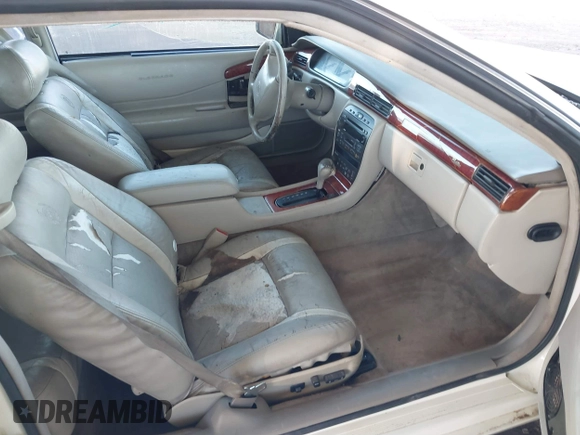 2002 Cadillac Eldorado z VIN 1G6EC12922B106670, wystawiony jako IAAI lot #41648782 z przebiegiem 174 320 mil mil oraz . Historia ofert i sprzedaży dostępna na DreamBid. Obrazek 5.