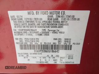 2014 Ford Taurus SEL with VIN 1FAHP2E86EG186642, listed as a IAAI auction lot 41901768 with 106,057 mi miles. Bid and sale history available at carsss.com. Image 9.