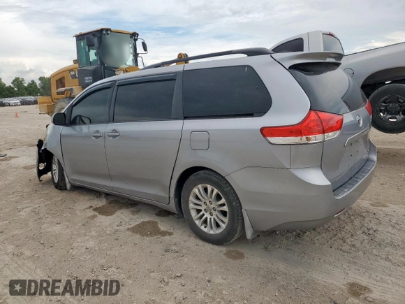 2013 Toyota Sienna XLE AAS with VIN 5TDYK3DC6DS291562, listed as a Copart auction lot 62411965 with 150,505 mi miles and Salvage title. Bid and sale history available at DreamBid. Image 2.