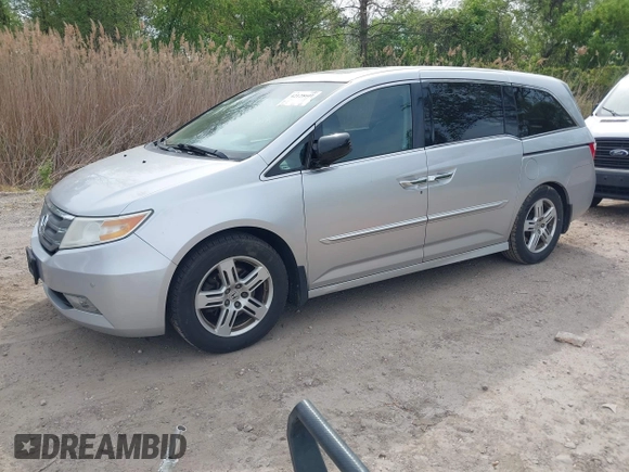 2012 Honda Odyssey Touring with VIN 5FNRL5H92CB055473, listed as a IAAI auction lot 42128601 with 163,901 mi miles. Bid and sale history available at carsss.com. Image 19.
