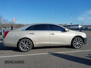 2013 Cadillac XTS Luxury z VIN 2G61R5S31D9185009, wystawiony jako IAAI lot #41243001 z przebiegiem 161 219 mil mil oraz . Historia ofert i sprzedaży dostępna na DreamBid. Obrazek 13.