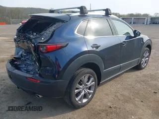 2021 Mazda CX-30 Premium with VIN 3MVDMBDM4MM238367, listed as a IAAI auction lot 42124335 with 31,120 mi miles and . Bid and sale history available at DreamBid. Image 4.