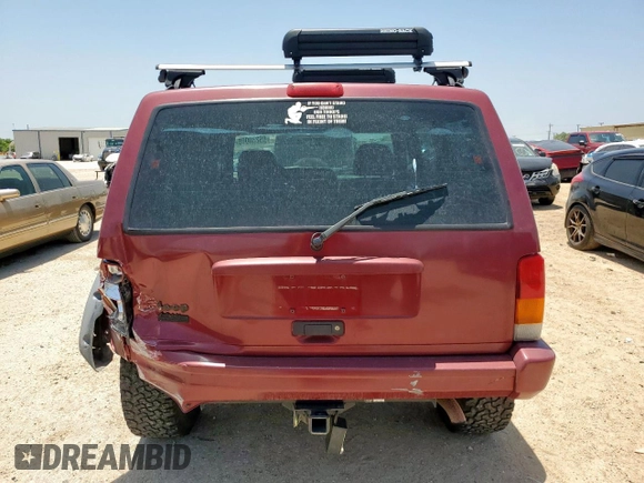 1999 Jeep Cherokee Sport с VIN 1J4FT68S5XL675839, выставлен на аукционе Copart как лот 65230005 с пробегом 204 102 миль миль и Списание • Salvage title. История ставок и продаж доступна на DreamBid. Изображение 6.