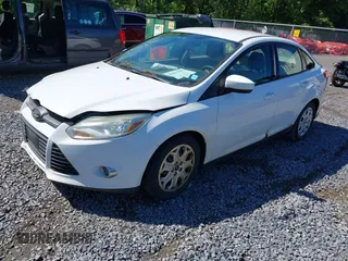 2012 Ford Focus SE with VIN 1FAHP3F27CL218986, listed as a IAAI auction lot 42633997 with 163,414 mi miles and . Bid and sale history available at DreamBid. Image 2.