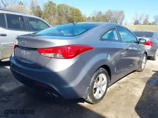 2013 Hyundai Elantra Coupe GS with VIN KMHDH6AE6DU013174, listed as a IAAI auction lot 41771119 with 143,115 mi miles. Bid and sale history available at carsss.com. Image 4.