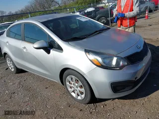 2015 Kia Rio LX with VIN KNADM4A3XF6483635, listed as a IAAI auction lot 41897270 with 136,981 mi miles. Bid and sale history available at carsss.com. Image 1.